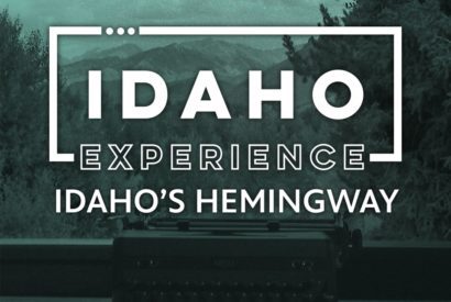 Text reads "Idaho Experience Idaho's Hemingway" and is superimposed on a photo of a typewriter overlooking a mountain vista.