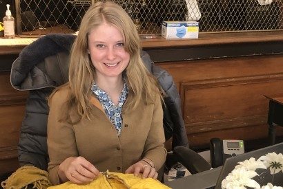 Olivia Terry, Regional History Museum Librarian, with an historic yellow jacket.