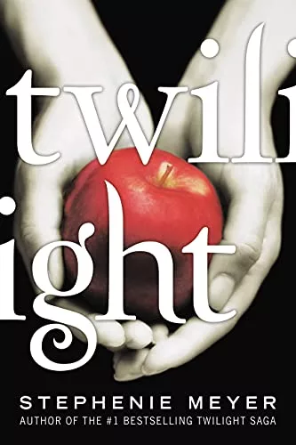 Black and White photo of hands holding a red apple with "Twilight" written across the front. 