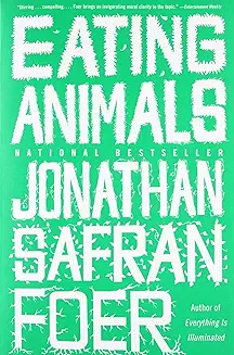 "Eating Animals" over the bright green background