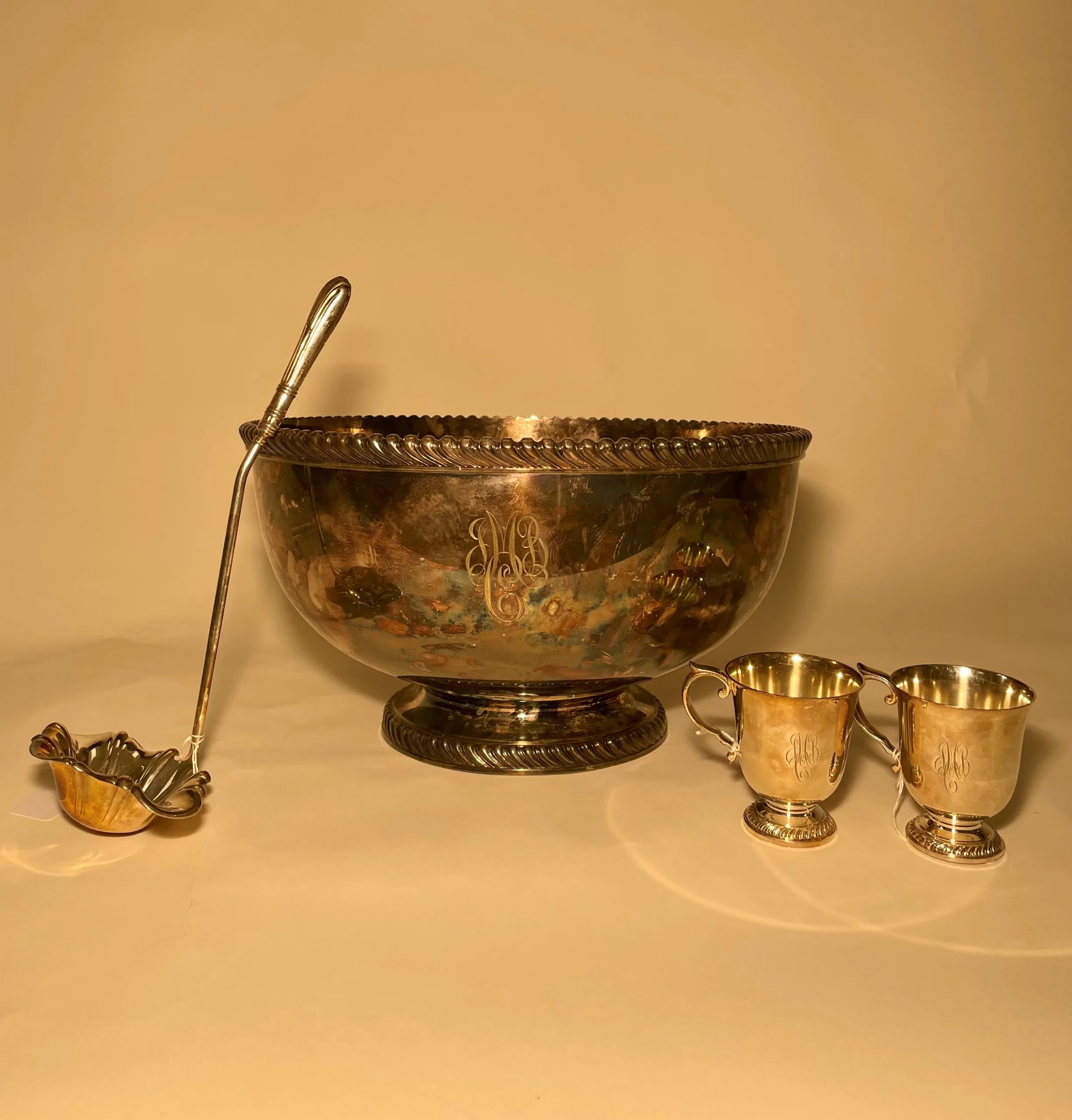Silver punch bowl, ladle, and cups