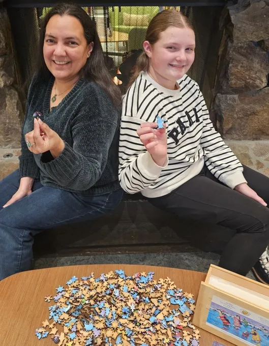 Candida and daughter Kire work out a puzzling puzzle