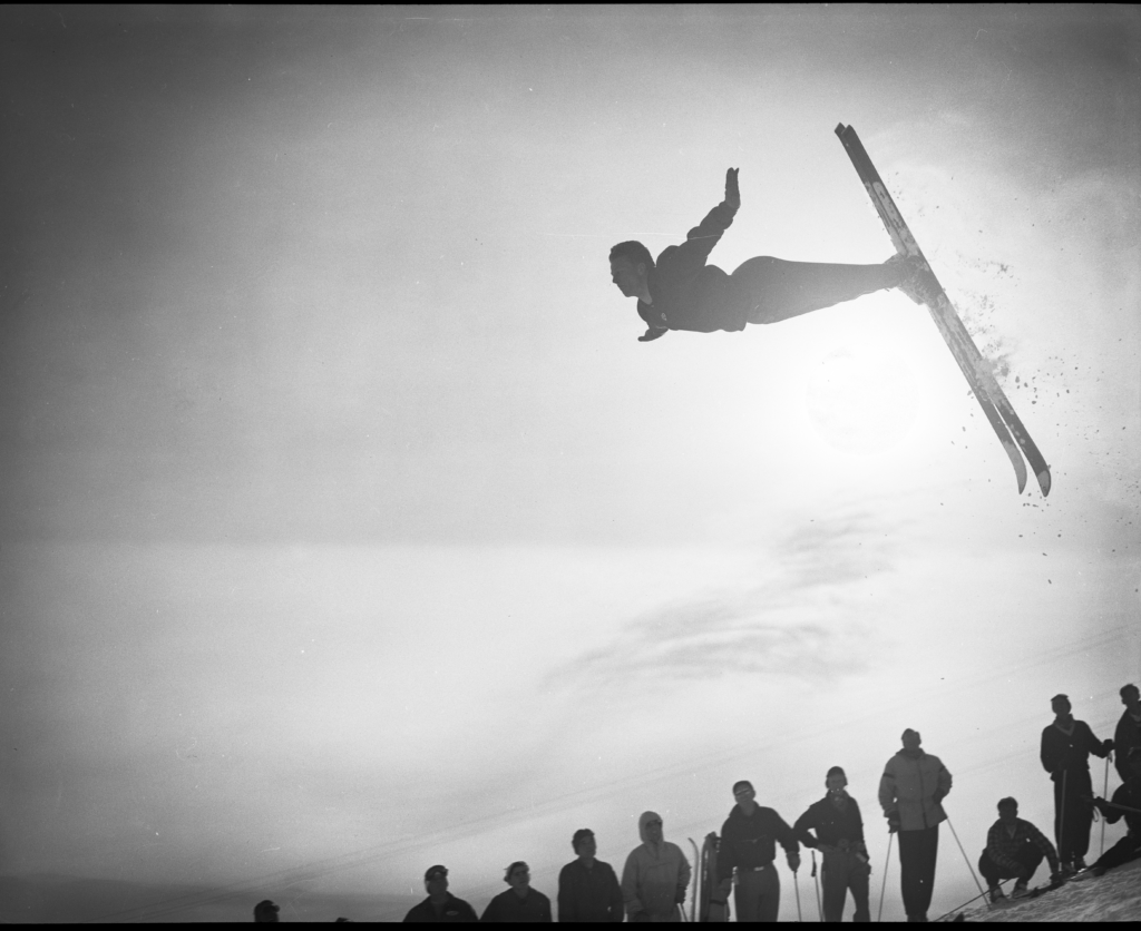 Olympian Stein Eriksen performing a front flip.