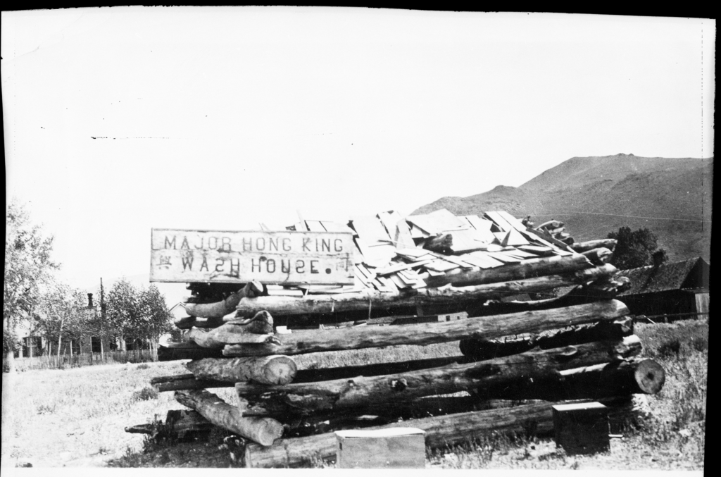 A very rustic cabin with a sign reading Major Hong King Wash House