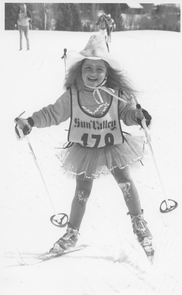 Amber Reidy on skis and wearing a costume.