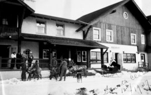 Reindeer pull a sleigh in front of the Challenger Inn