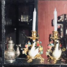 A pair of Swan Candlelabra in the window. Swan Candlelabra